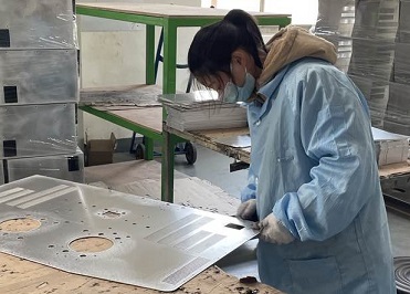 Deburring of metal sheet plates