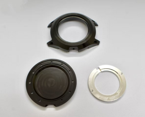 CNC-machined watch case set: carrure, case back (fond), and stainless-steel movement ring (cercle) for AOS watch project 1983