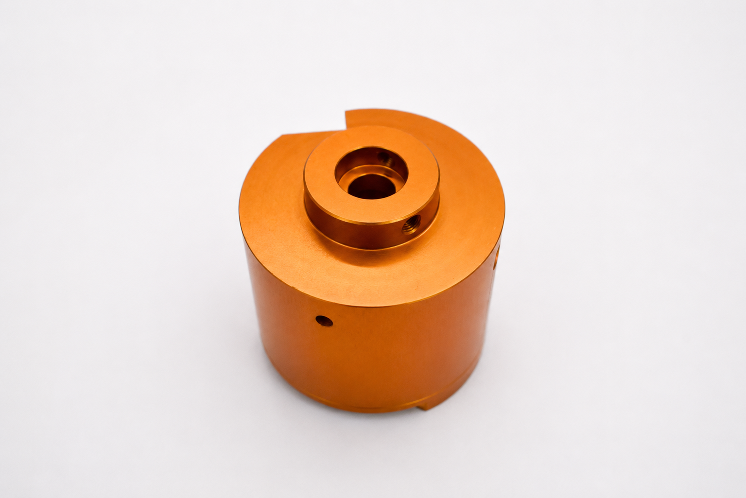 Yellow anodized aluminum CNC machined housing with threaded interfaces