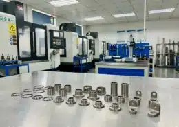 Precision CNC machined titanium parts displayed in a machining workshop