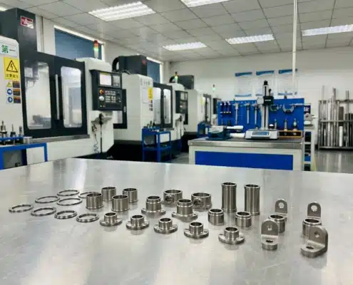 Precision CNC machined titanium parts displayed in a machining workshop
