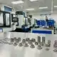 Precision CNC machined titanium parts displayed in a machining workshop